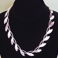 silver necklace at beach treasures