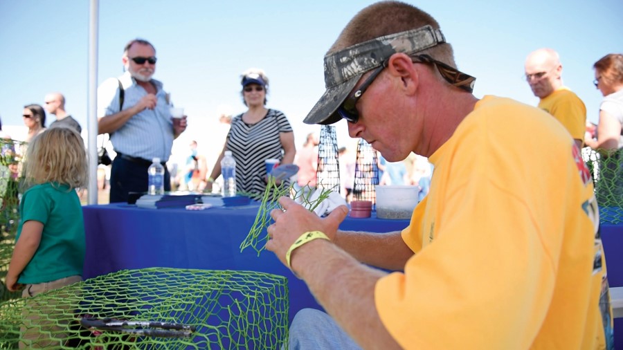 Fisherman working on a crab pot at the Outer Banks Seafood Festival