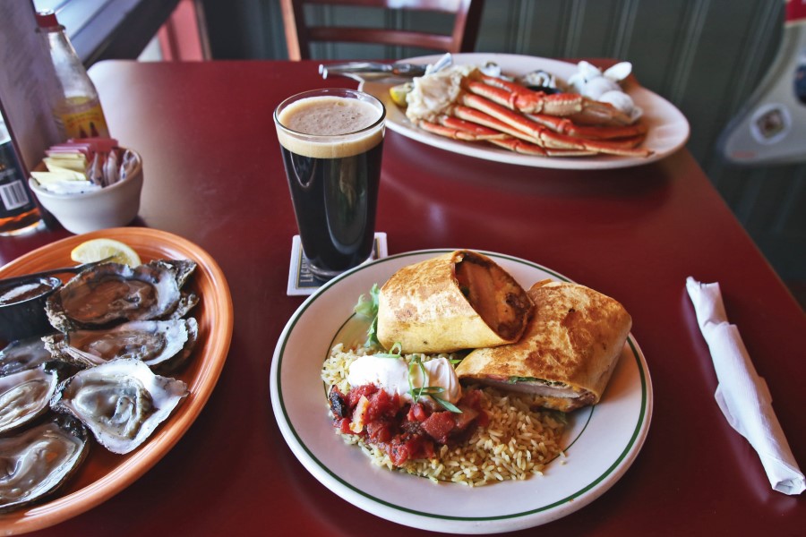 Shot of Red Drum's food offerings along with a pint of beer