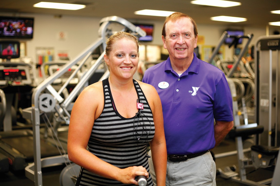 Guest posing with Outer Banks Family YMCA staff member