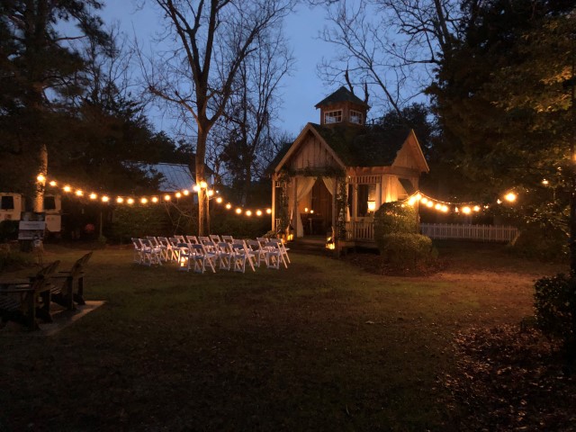 Inn Garden in the Evening with Lighting and Chairs