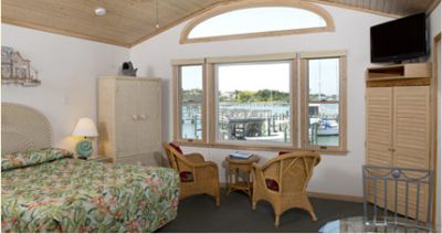 Harbor-front studio suite with a queen bed at Ocracoke Harbor Inn