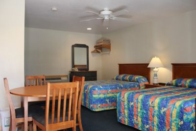 Efficiency room with two double beds at Pony Island Motel