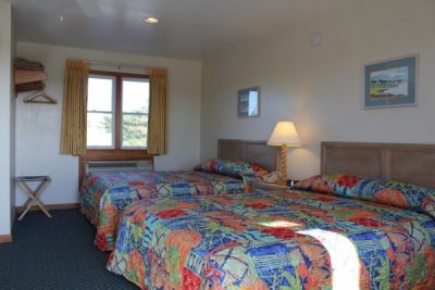 Room with two queen beds at Pony Island Motels