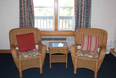 Seating area of poolside room at Pony Island Motel