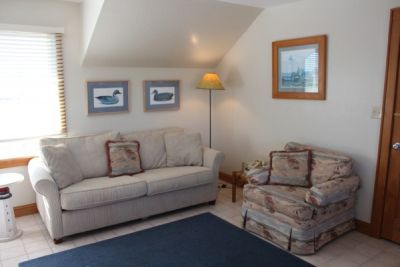 Seating area in poolside room at Pony Island Motel