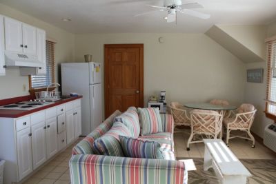 Kitchen and eating area of poolside room at Pony Island Motel