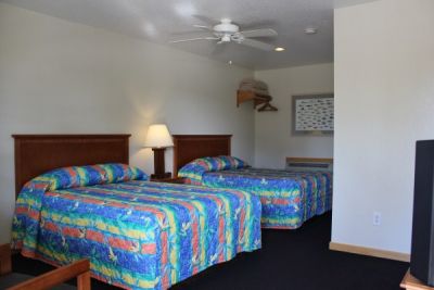 Room with two double beds at Pony Island Motel