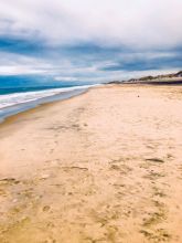 Beach and Ocean with Cloudy Sky